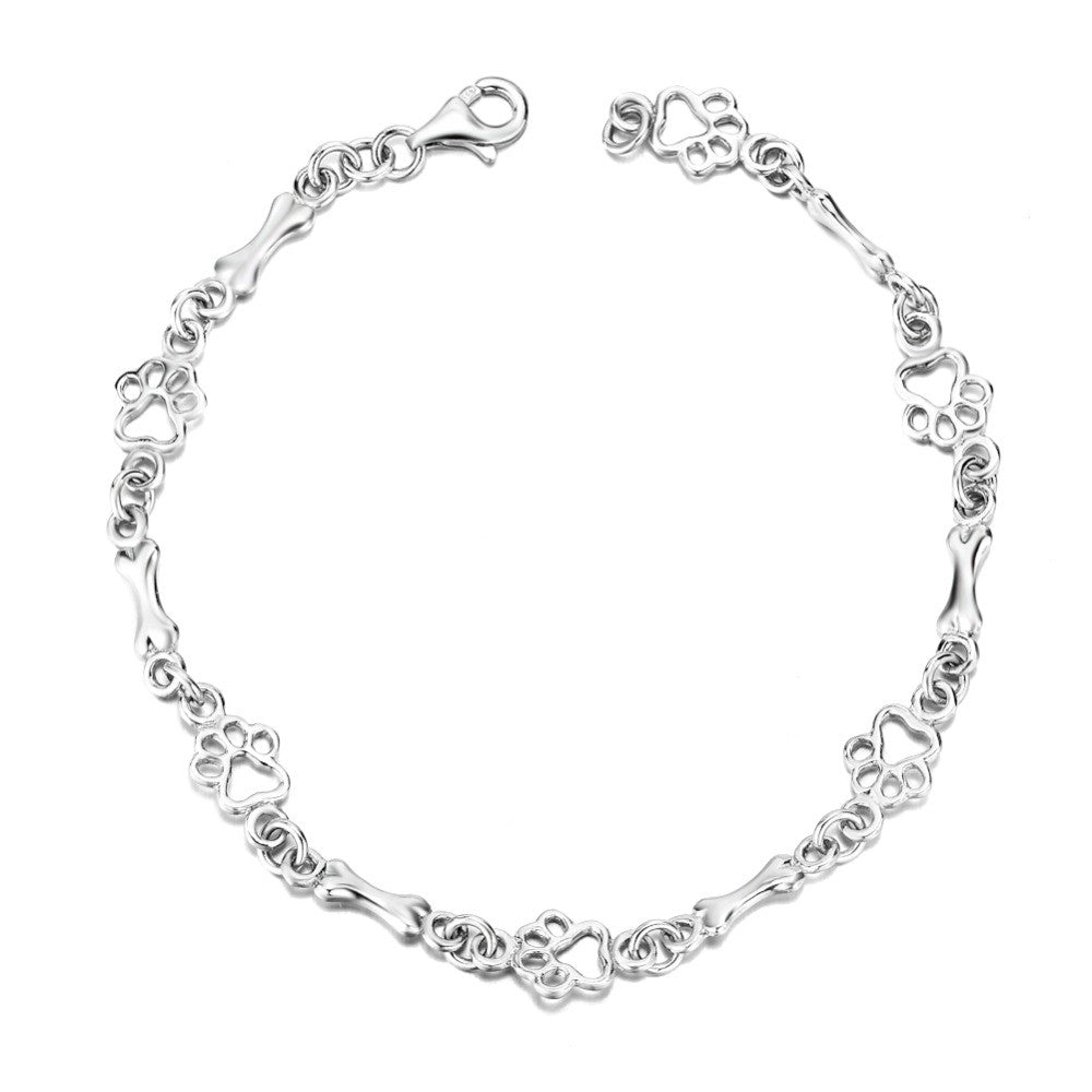 Armband mit Anhängern aus reinem Silber in Form von Hundepfoten und Knochen
